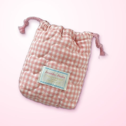 a pink gingham drawstring carry bag