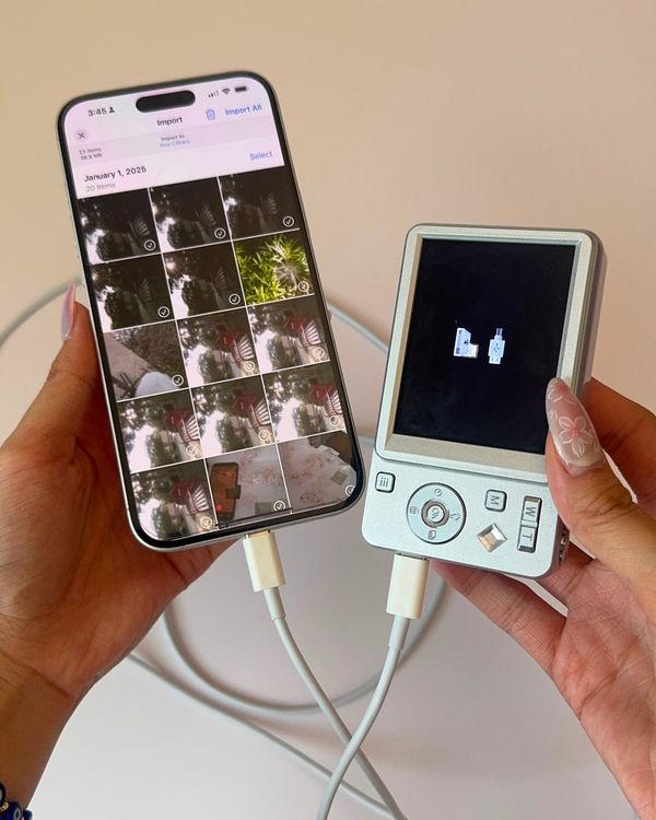 a camera plugged into a phone to move photos