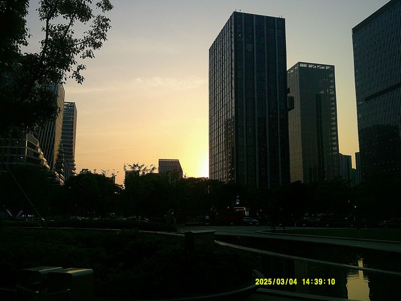 city towers against a sunset sky