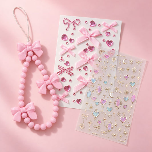 a pink bow beaded strap and two sticker sheets laid flat